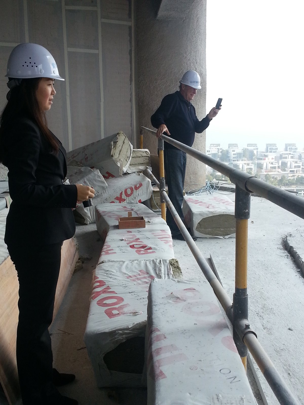 Dandi Passerini in a hard hat on a construction site